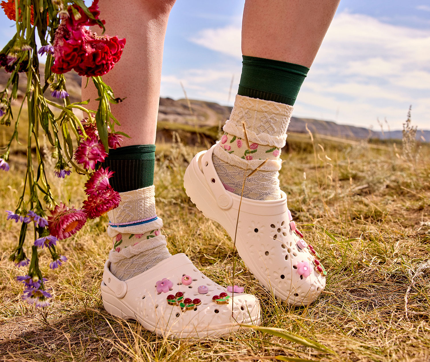 womens fuzzy crocs classic clog walking on sidewalk.